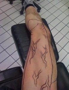 Penis on the leg tattoo