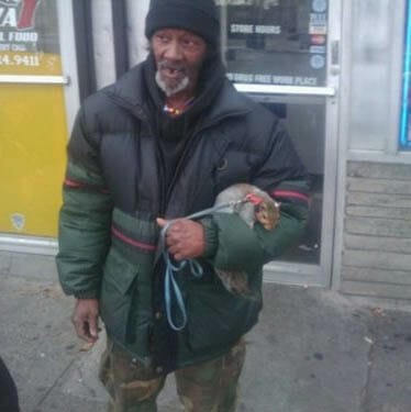 homeless guy with squirrel on a leash