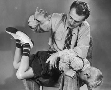 50s dad spanking a child