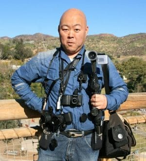 Japanese tourist with many cameras